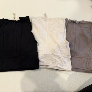 Set of Black, White, and Tan Sleeveless Tops